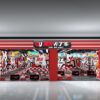 卡丁车样板店1 A detailed indoor go-kart racing track with vibrant red, black, and white decor, featuring multiple racing lanes, safety barriers, and colorful lighting effects, designed for competitive karting event.