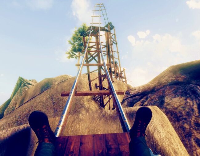 View of a mining headframe structure on a rocky hilltop under a blue sky, representing mineral extraction and mining industry.