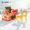 Santa sleigh and reindeer in snowy winter landscape. Christmas sleigh and reindeer decorations in a snowy winter scene, perfect for holiday festivities and Christmas events. Bright red sleigh with gold accents and festive reindeer create a joyful holiday atmosphere.