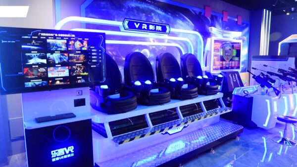 High-tech VR gaming experience with multiple seats, immersive screens, and advanced virtual reality equipment for entertainment and gaming enthusiasts.