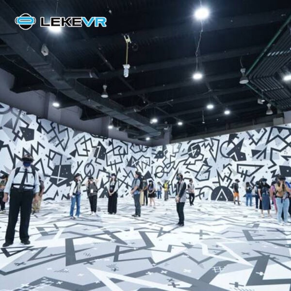 LekeVR Expo. People experiencing immersive VR at LekeVR virtual reality center with vibrant black and white geometric visuals.