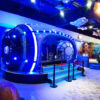 Imaginative indoor amusement park featuring a sci-fi capsule ride, colorful visuals, and engaging activities for children and visitors.