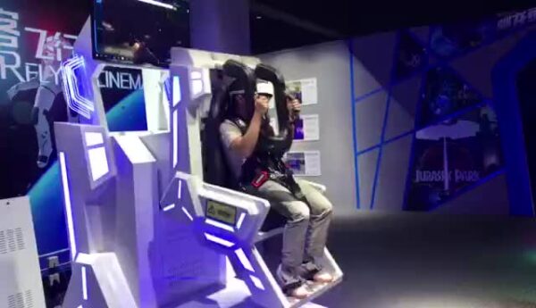 Immersive Virtual Reality Ride. A person experiencing a high-tech virtual reality amusement ride with advanced VR gear and engaging display screens in a modern entertainment setting.