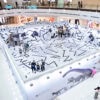 Indoor VR experience with dynamic geometric design at Lekevr Export shopping mall. Immersive virtual reality zone in a shopping mall featuring bold geometric patterns and dinosaur elements, perfect for entertainment and family fun.