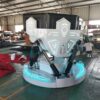 Futuristic robot with illuminated LED accents in a manufacturing workshop. Highly advanced robot prototype with LED lighting, robotic arms, and modern design shown in industrial workshop environment for automation solutions.