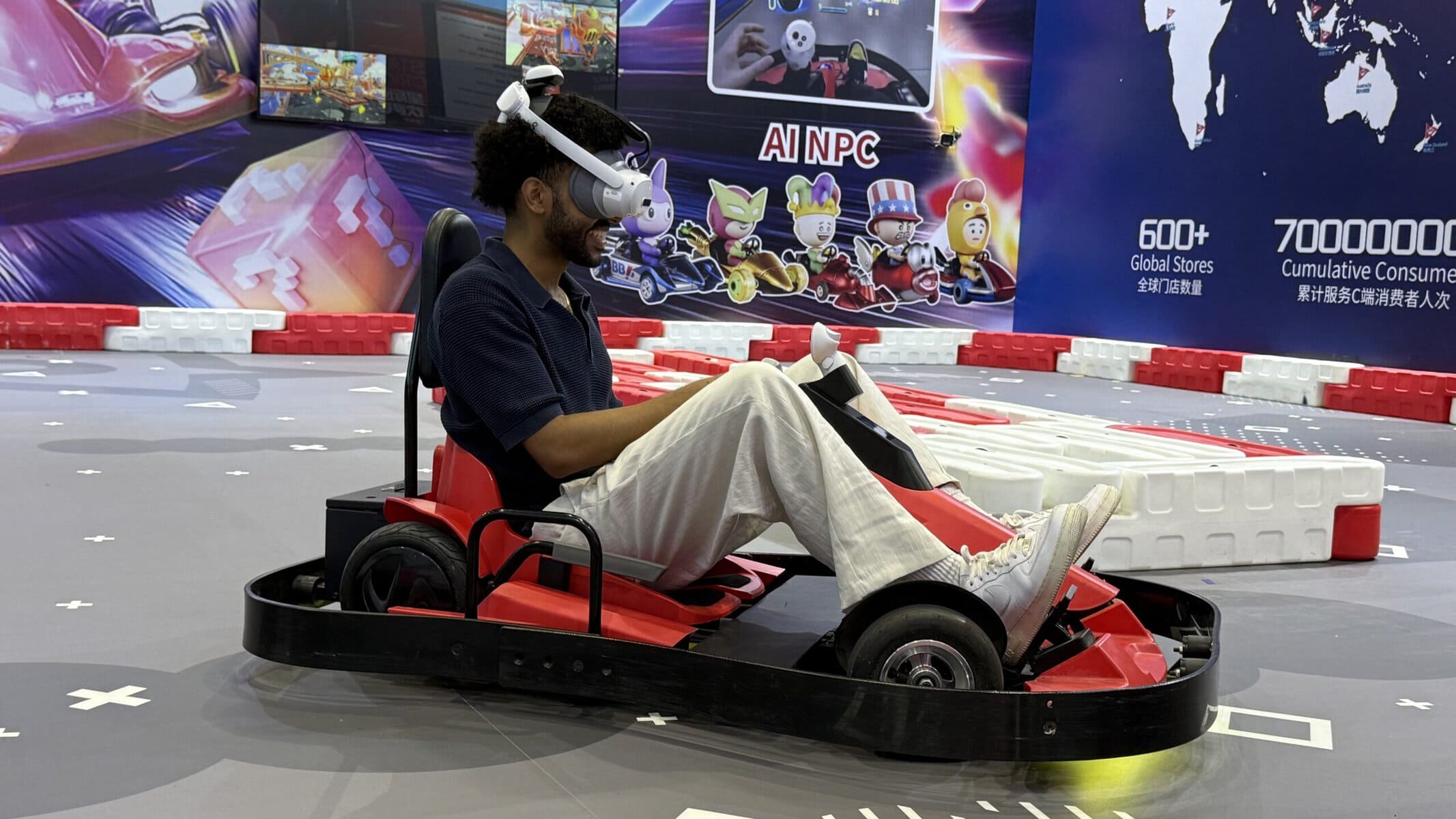 VR Equipment Manufacturer Insights: The Ultimate 2026 Asia Amusement Expo Recap 3 Customers testing the mr go-kart racing simulator provided by a commercial VR equipment supplier.