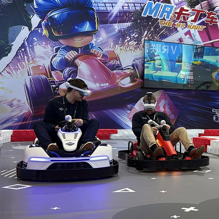 Two players racing on LEKE VR MR Go-Kart mixed-reality motion platform inside an FEC